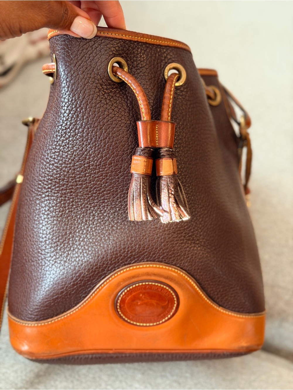 Dooney & Bourke Dark Brown Pebbled Leather Bucket Bag with Tan Trim